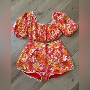 Vici Bahama Breeze Puff Sleeve Crop Top and Pocketed High Rise Floral Shorts
